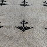 White and black carpet with berber patterns hand-woven in natural wool