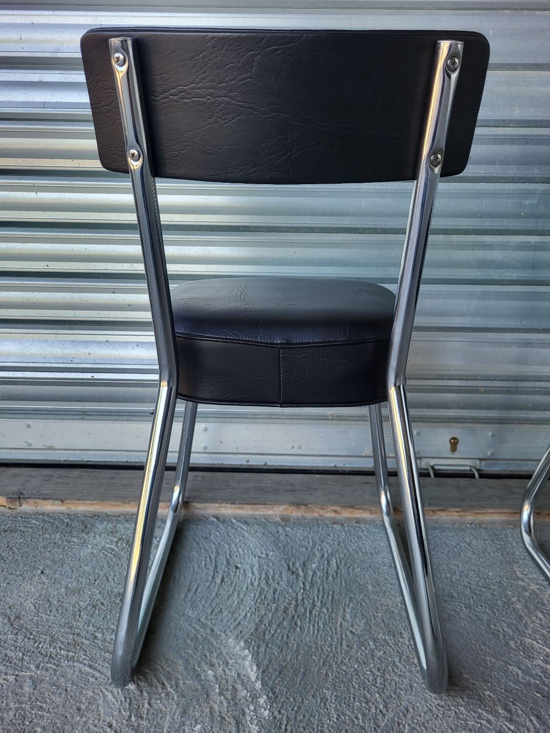 Pair of vintage black and chrome leatherette office chairs in very good condition