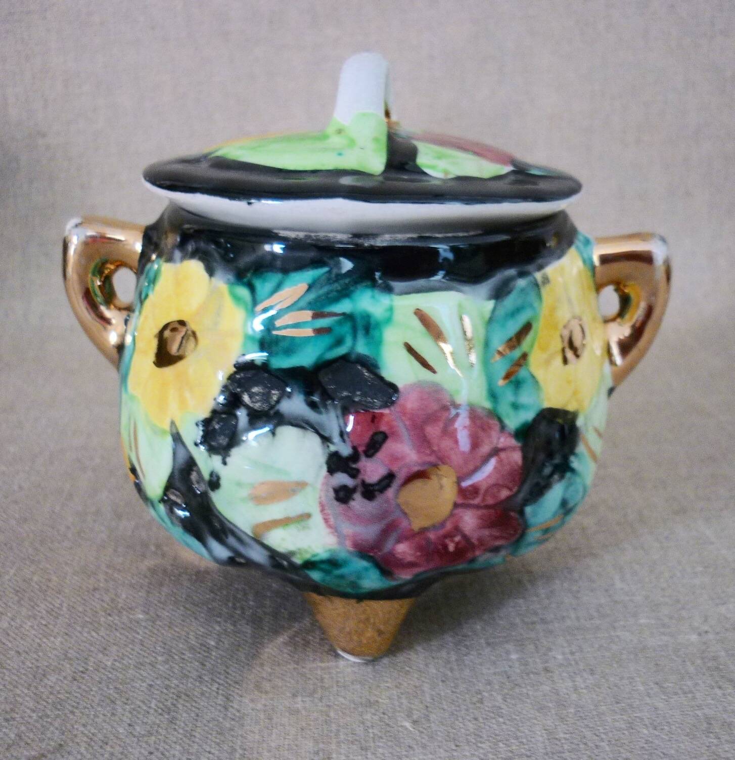 Multicolored ceramic covered tripod pot