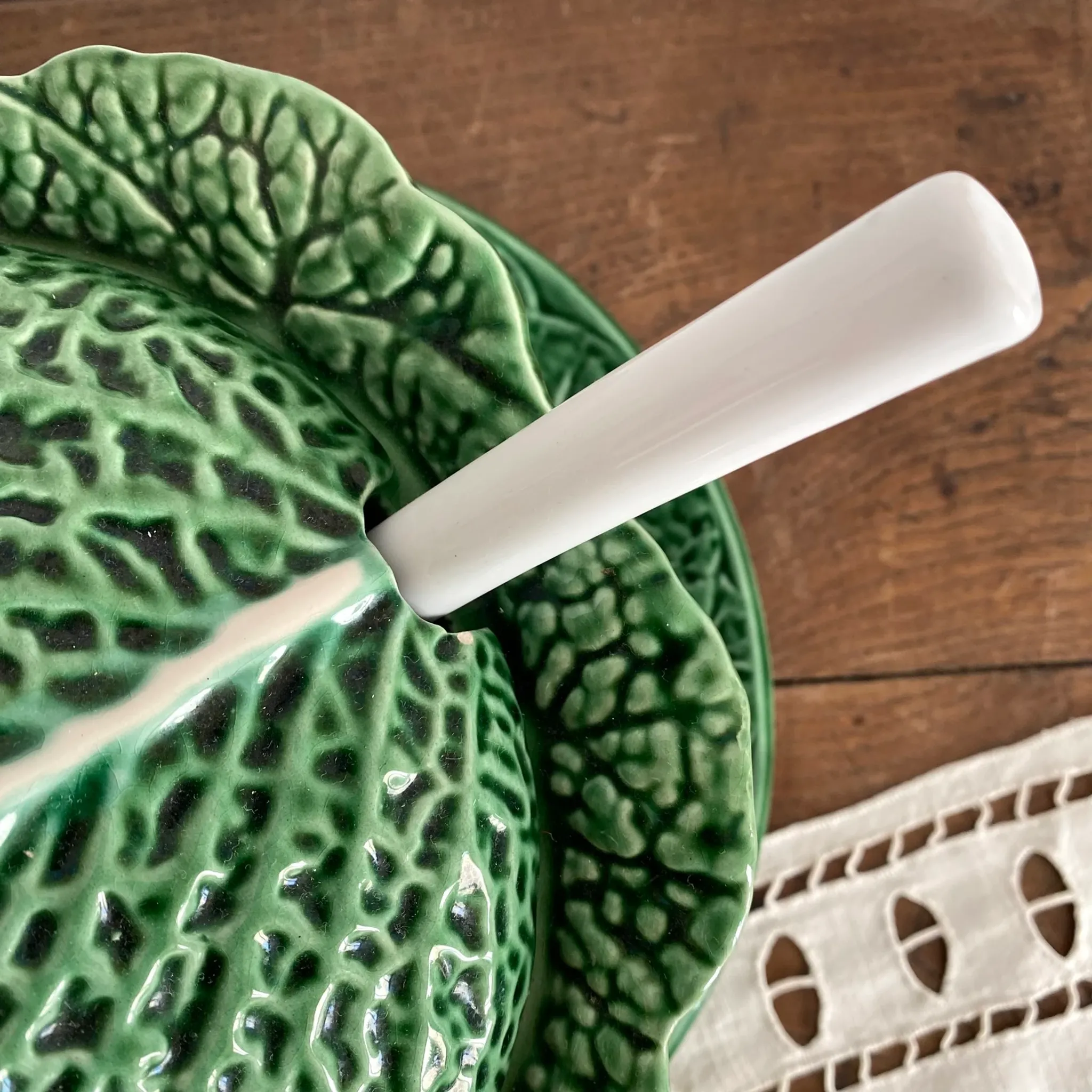 Large soup tureen in earthenware with a cabbage design, along with a dish and spoon.