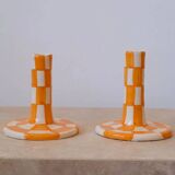 Pair of yellow and white checkered ceramic candlesticks