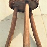 Rustic tripod stool seat covered with goatskin