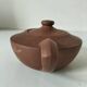 Japanese teapot in red clay engraved with integrated filter.