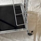 Modernist serving trolley in chromed metal and black smoked glass