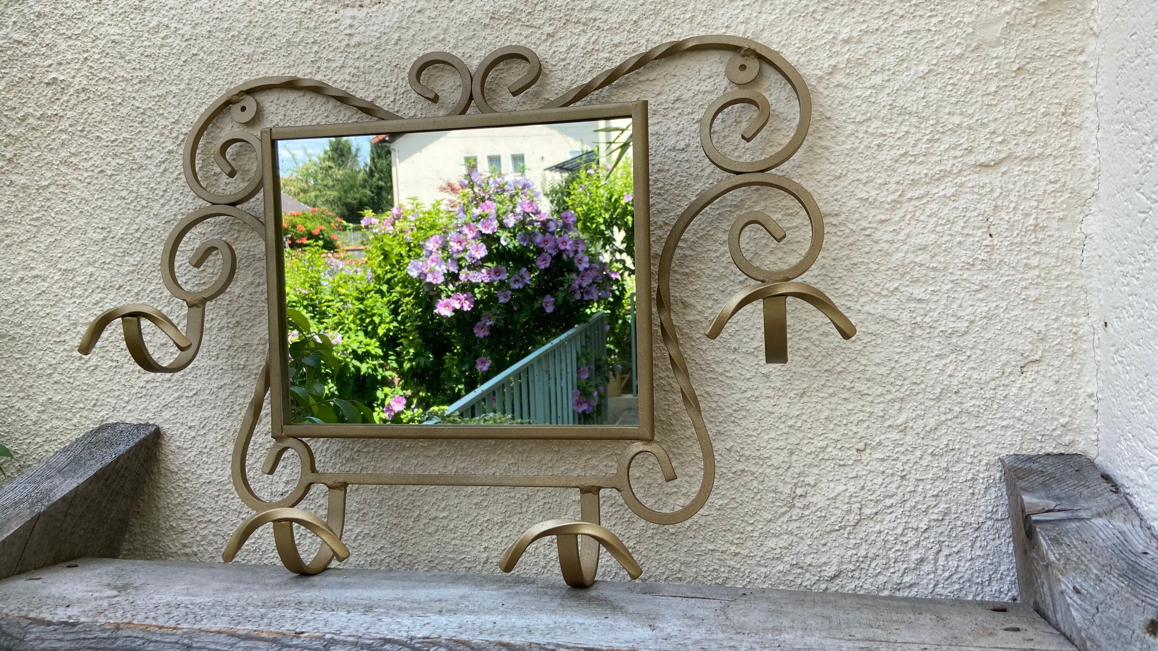 Wall-mounted gilded wrought iron coat rack with mirror