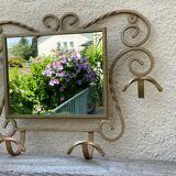 Wall-mounted gilded wrought iron coat rack with mirror