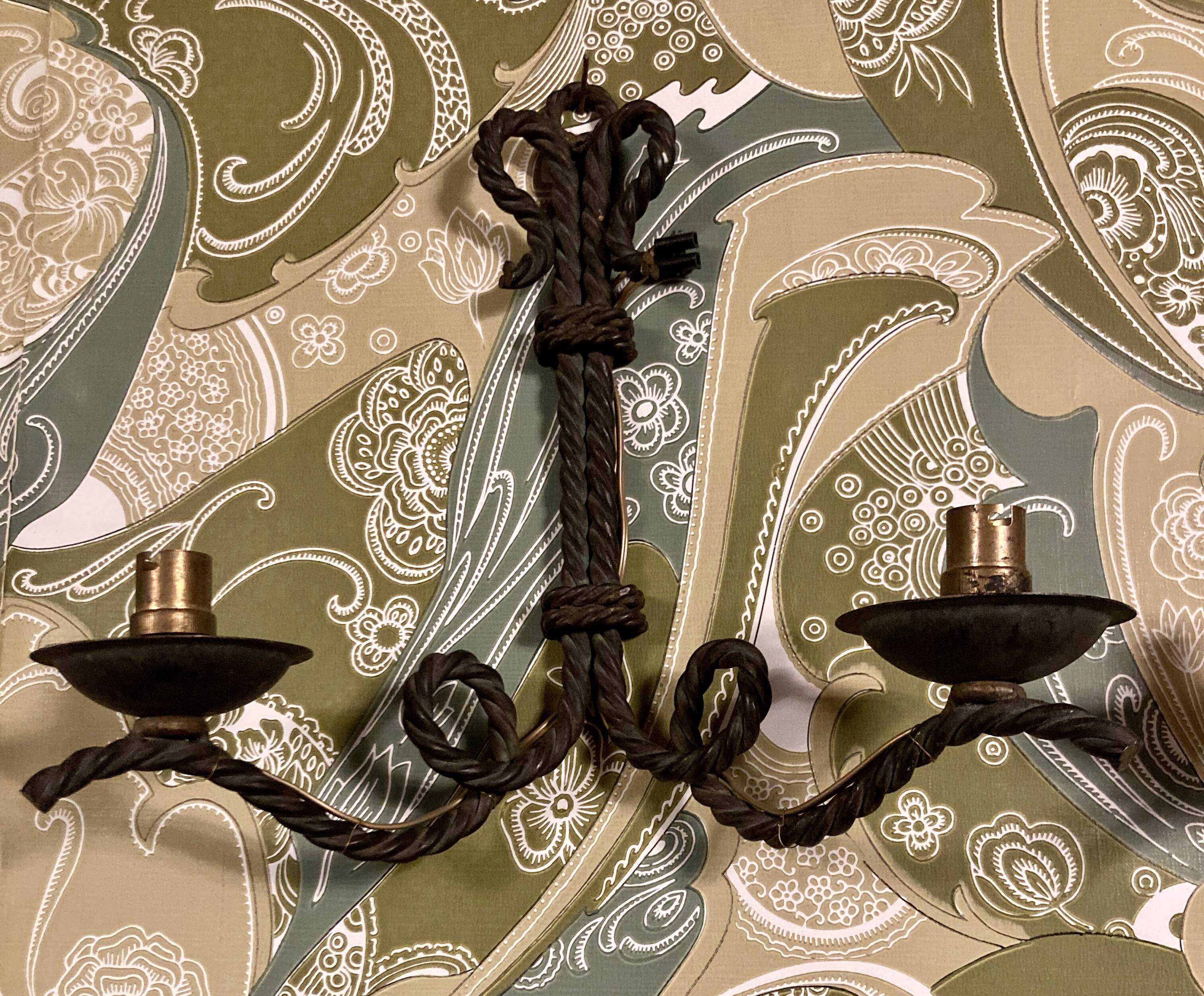 Pair of corded wrought iron wall lights