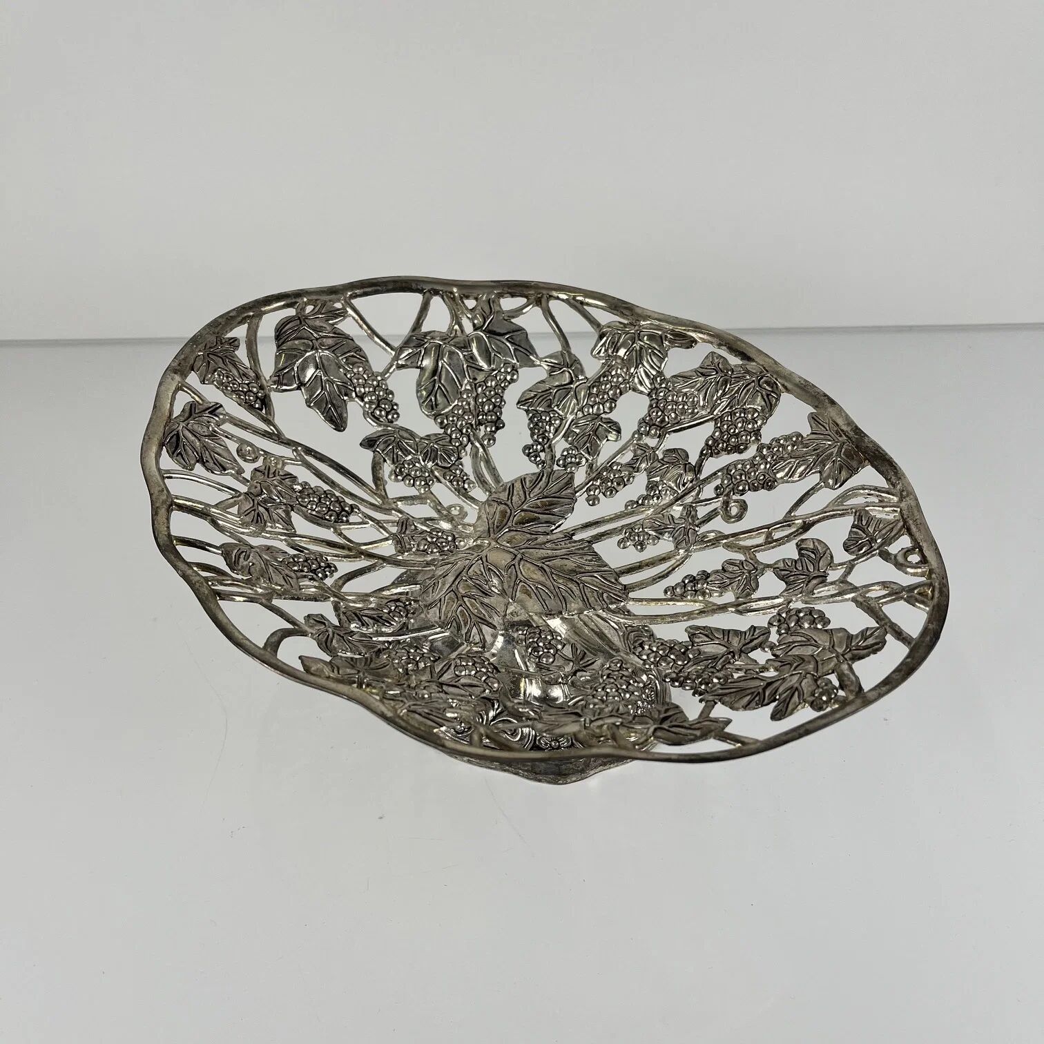 Openwork metal bowl with vine leaf and grape motif, 20th century