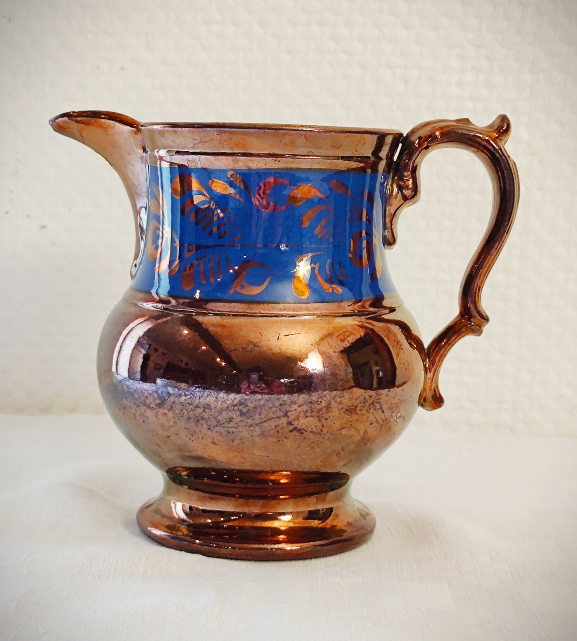 Copper and blue jersey ceramic pitcher