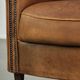 Aged sheepskin clubchair with beautiful vintage patina and comfortable seat