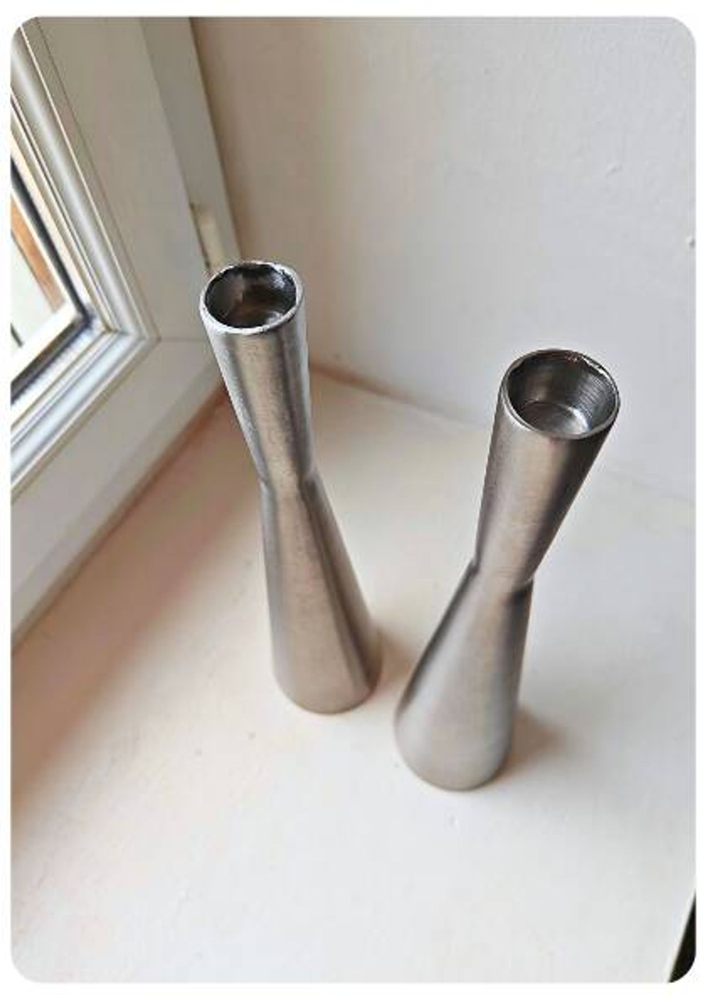 Pair of vintage brushed metal candlesticks