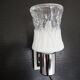 Transparent and white glass torch-type wall light.