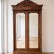 Antique walnut wardrobe with bevelled mirrors.