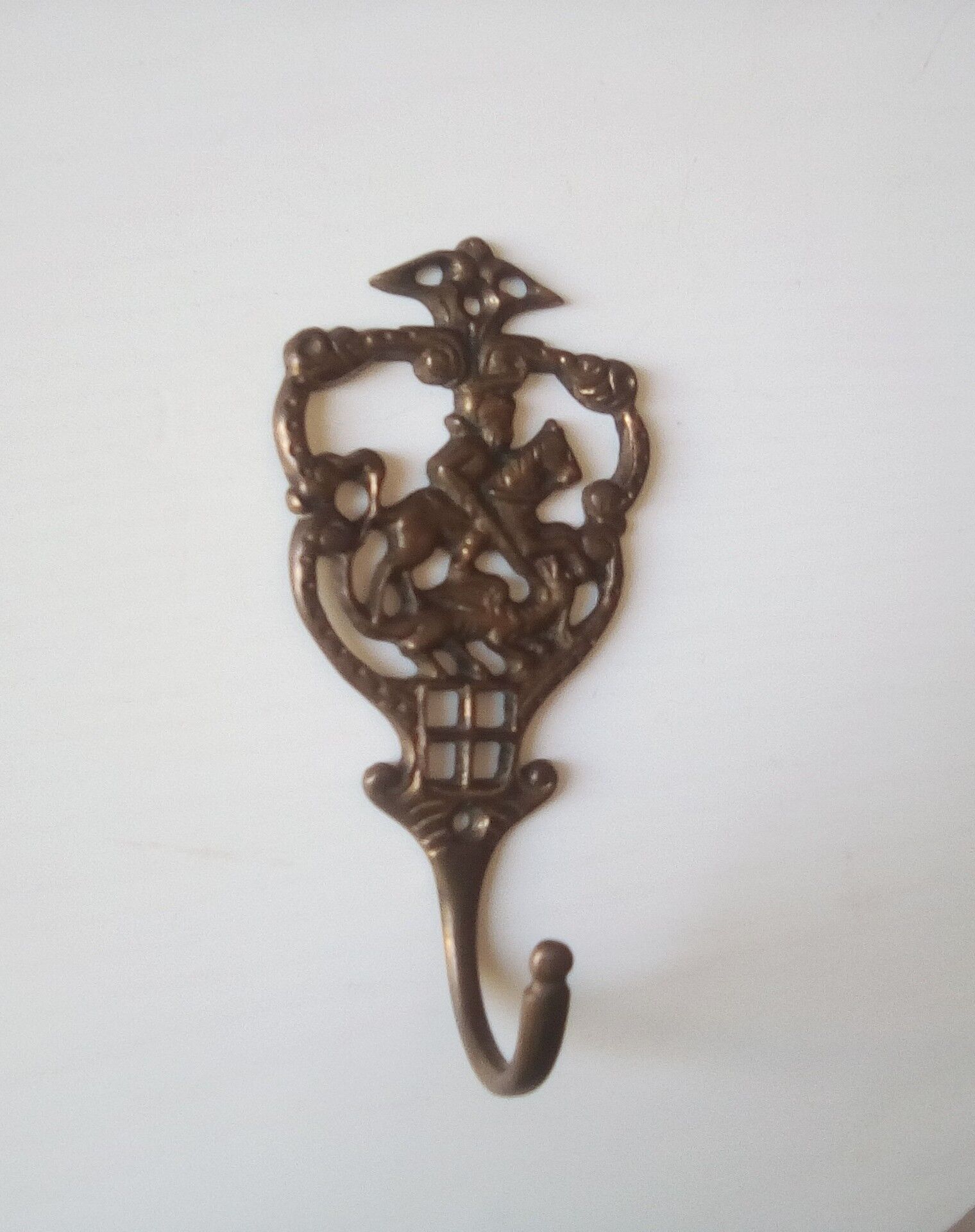 Old brass patère coat rack