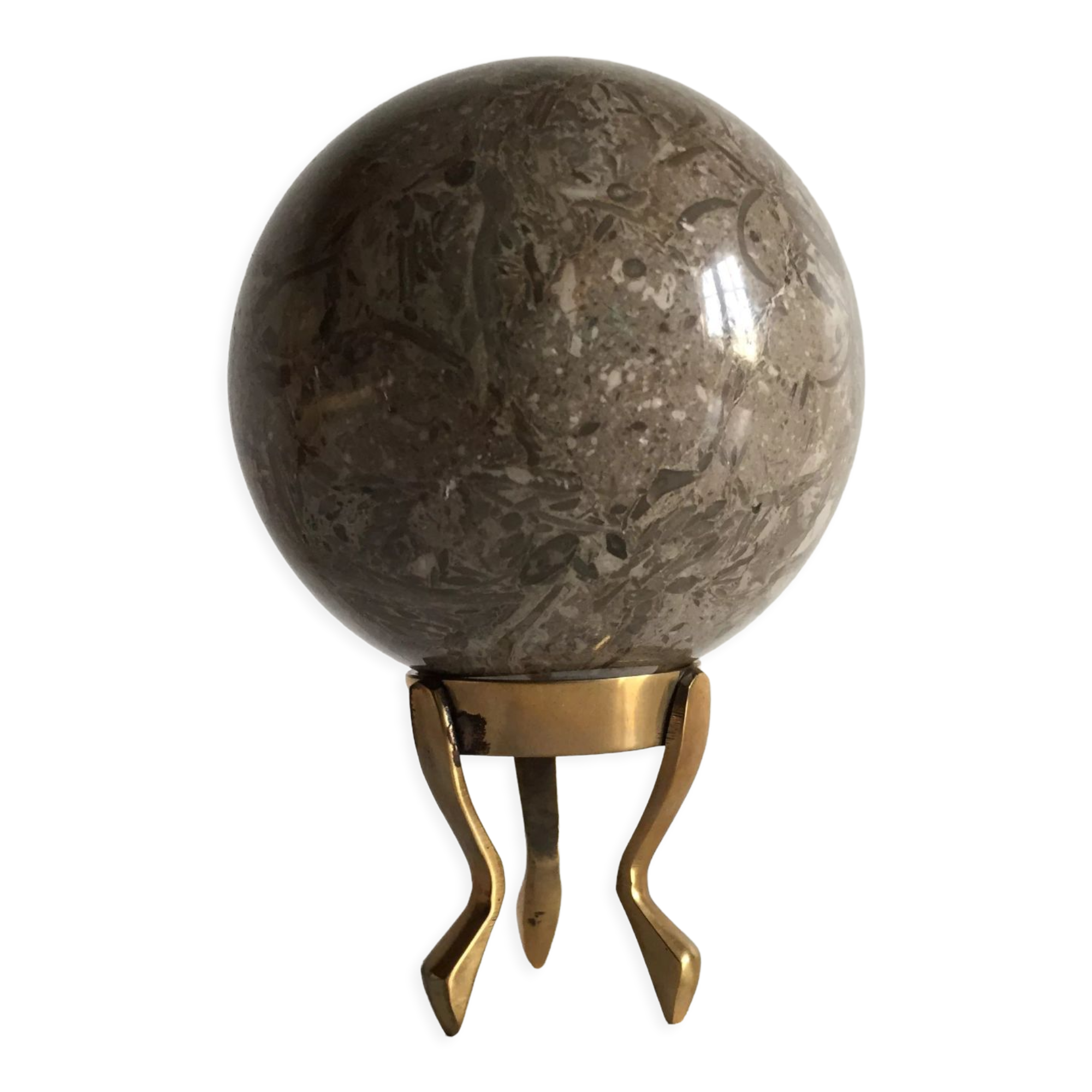 Marble ball paperweight on vintage brass