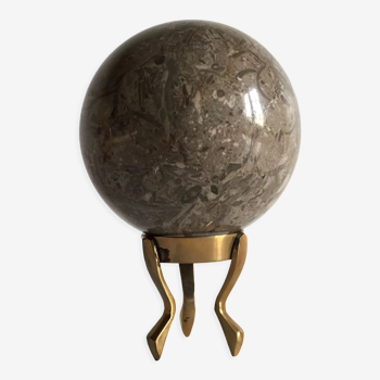 Marble ball paperweight on vintage brass