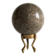 Marble ball paperweight on vintage brass