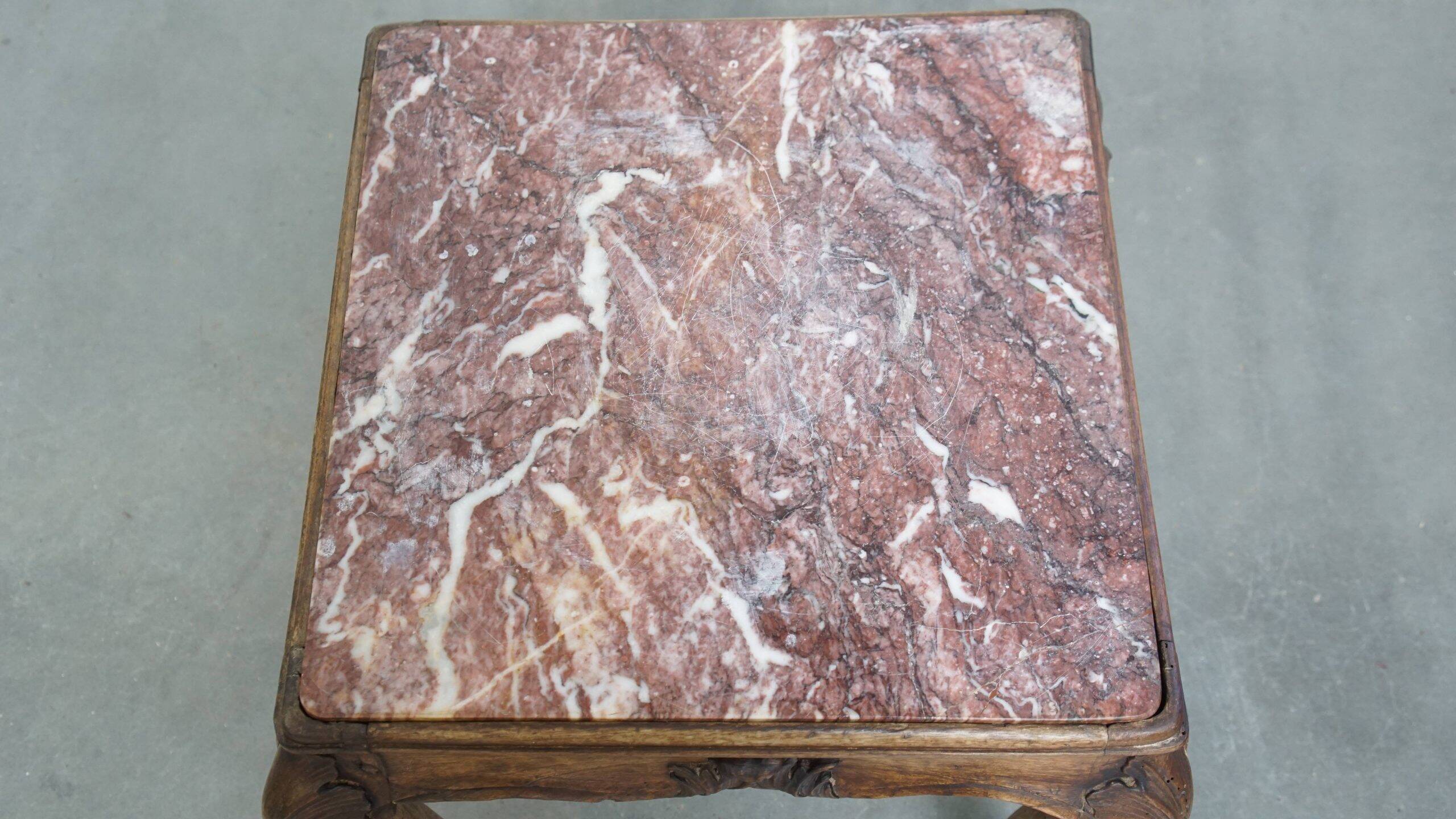 French late 18th century side table with a wooden frame and a marble top