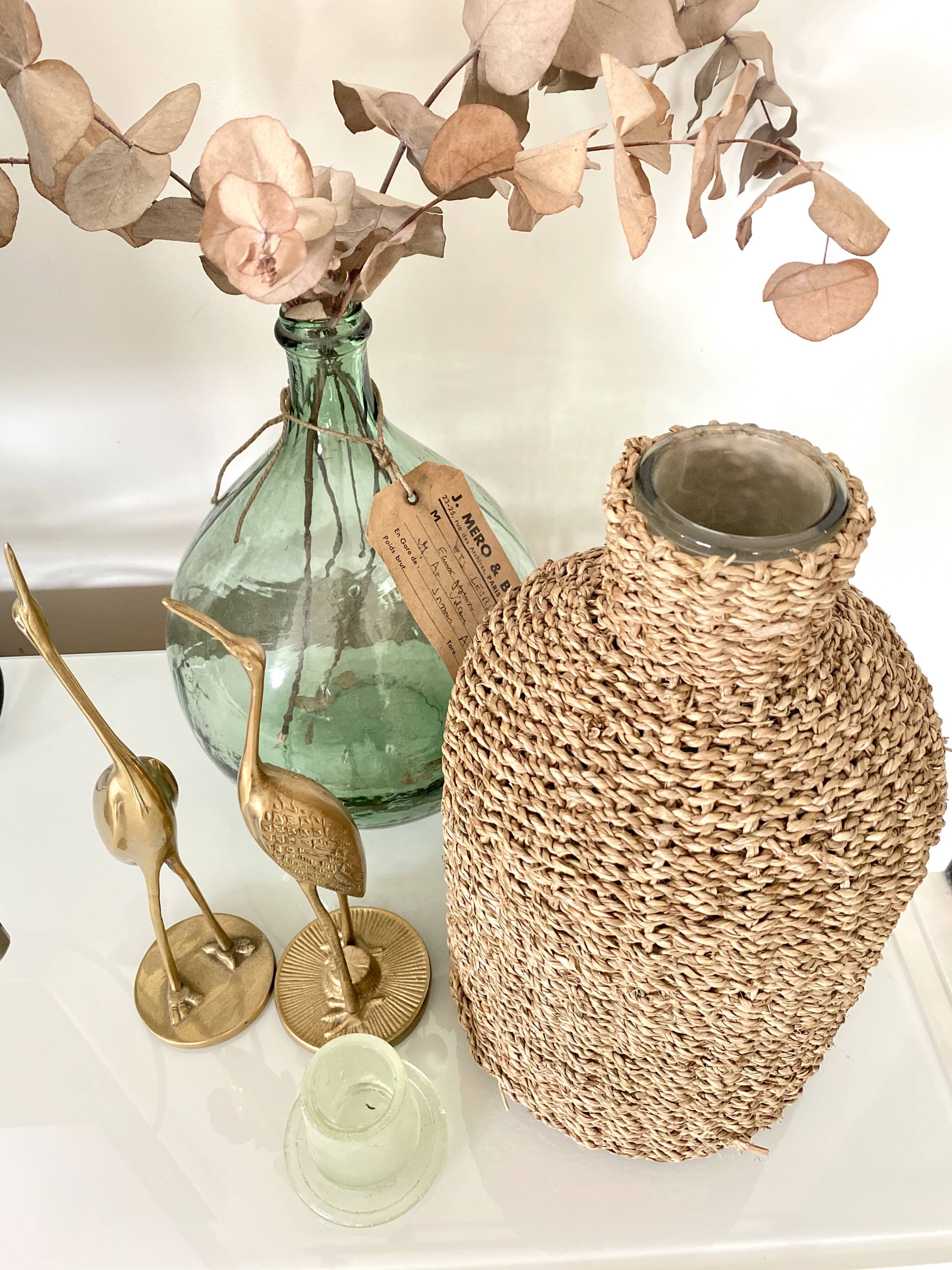 Glass bottle and braided rope