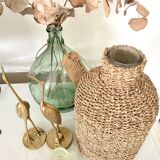 Glass bottle and braided rope