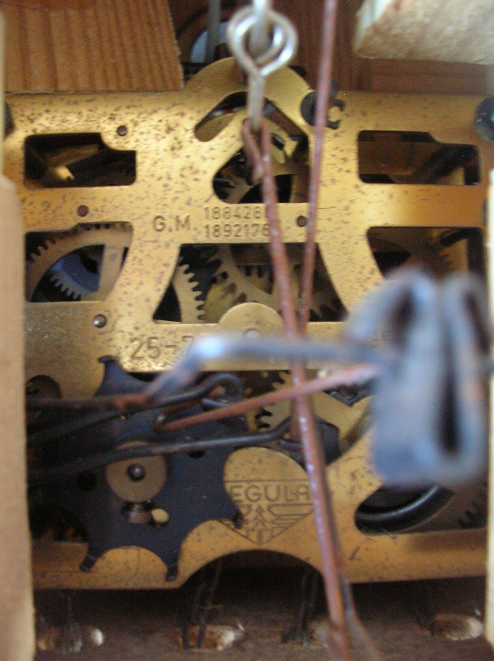 Old mechanical cuckoo regula wooden weight pine cone clock pendulum