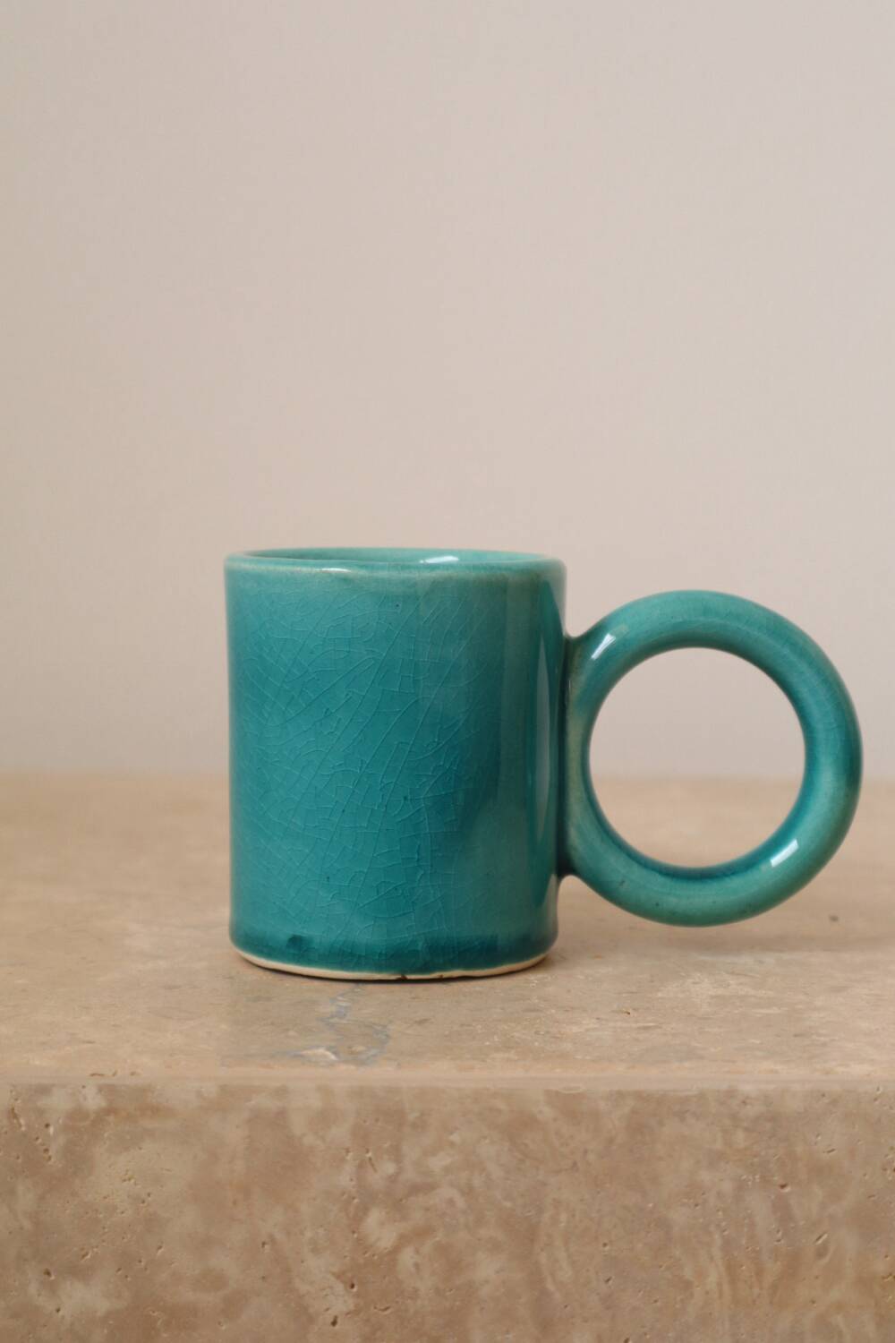 Pair of handmade turquoise ceramic coffee cups with large handles