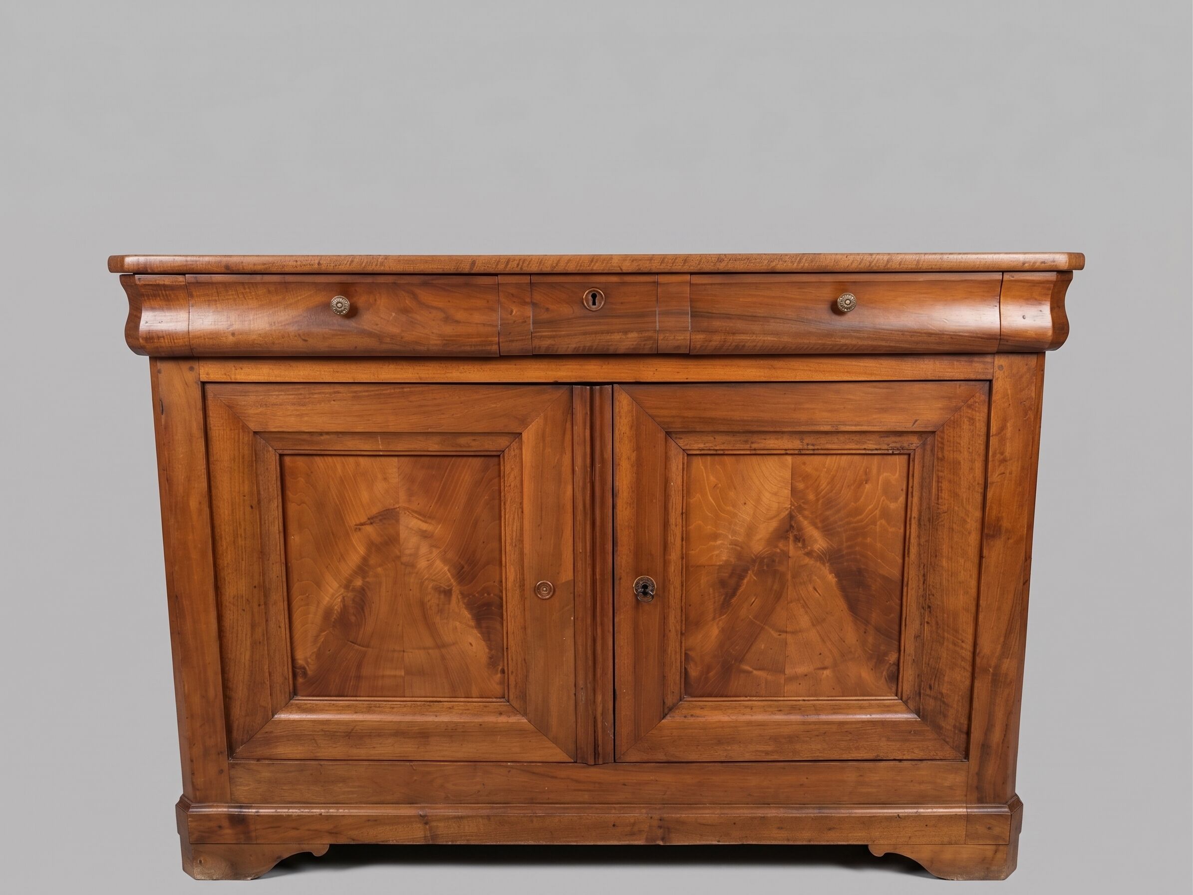 Very old in solid walnut.