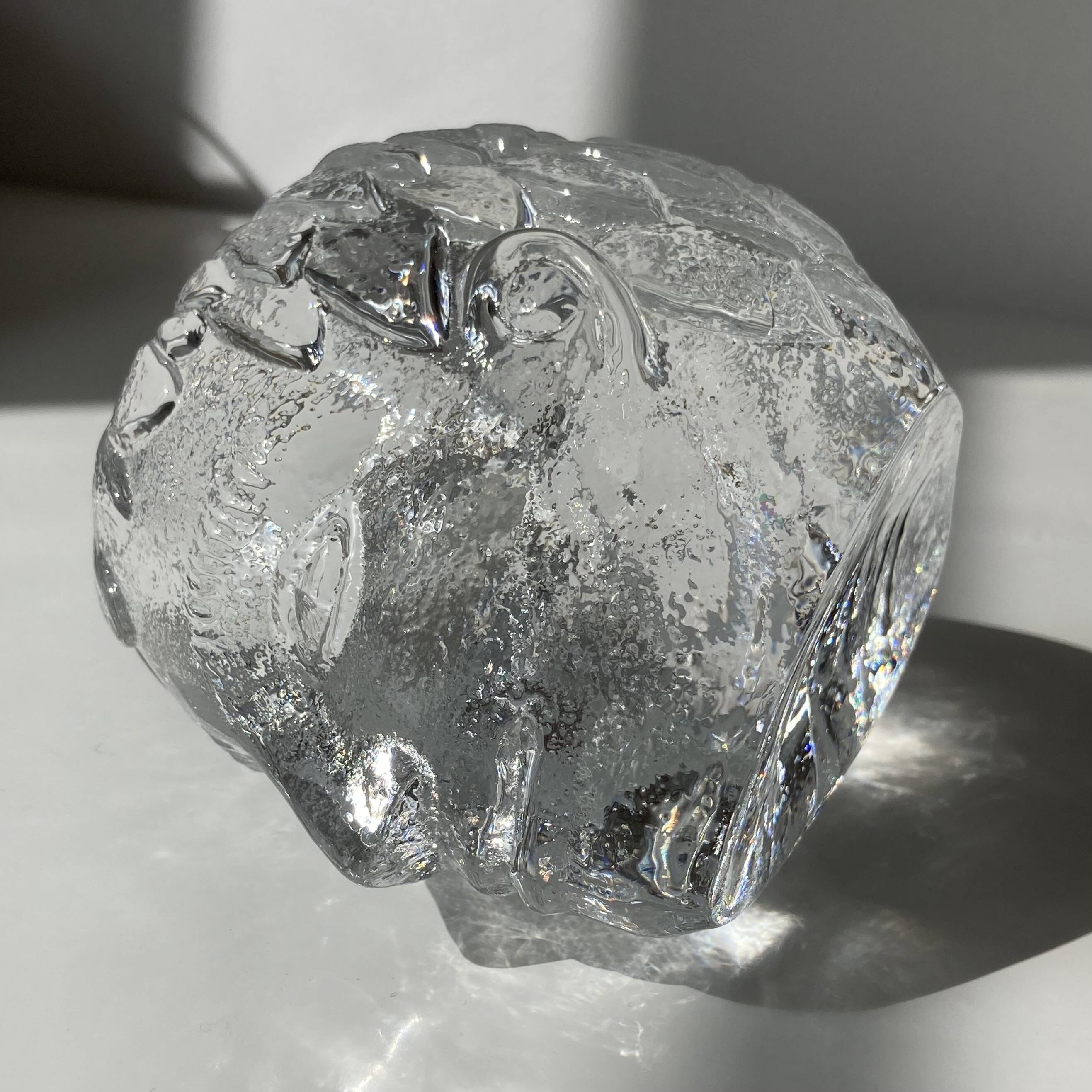 Glass candlestick by Bertil Vallien for Kosta Boda, man's head.