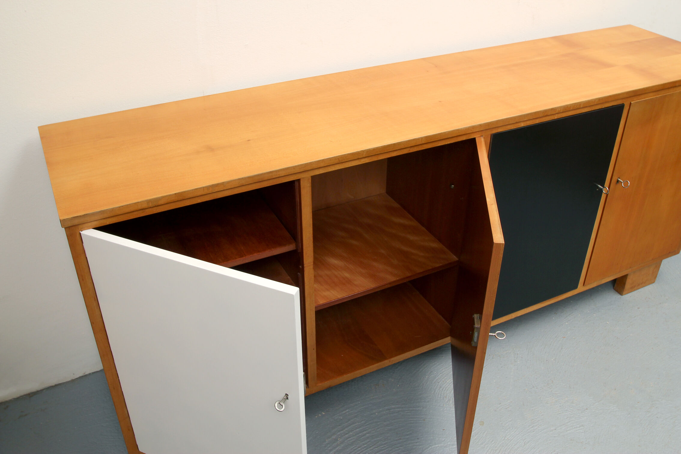 Sideboard in cherrywood with black and white doors 1950s