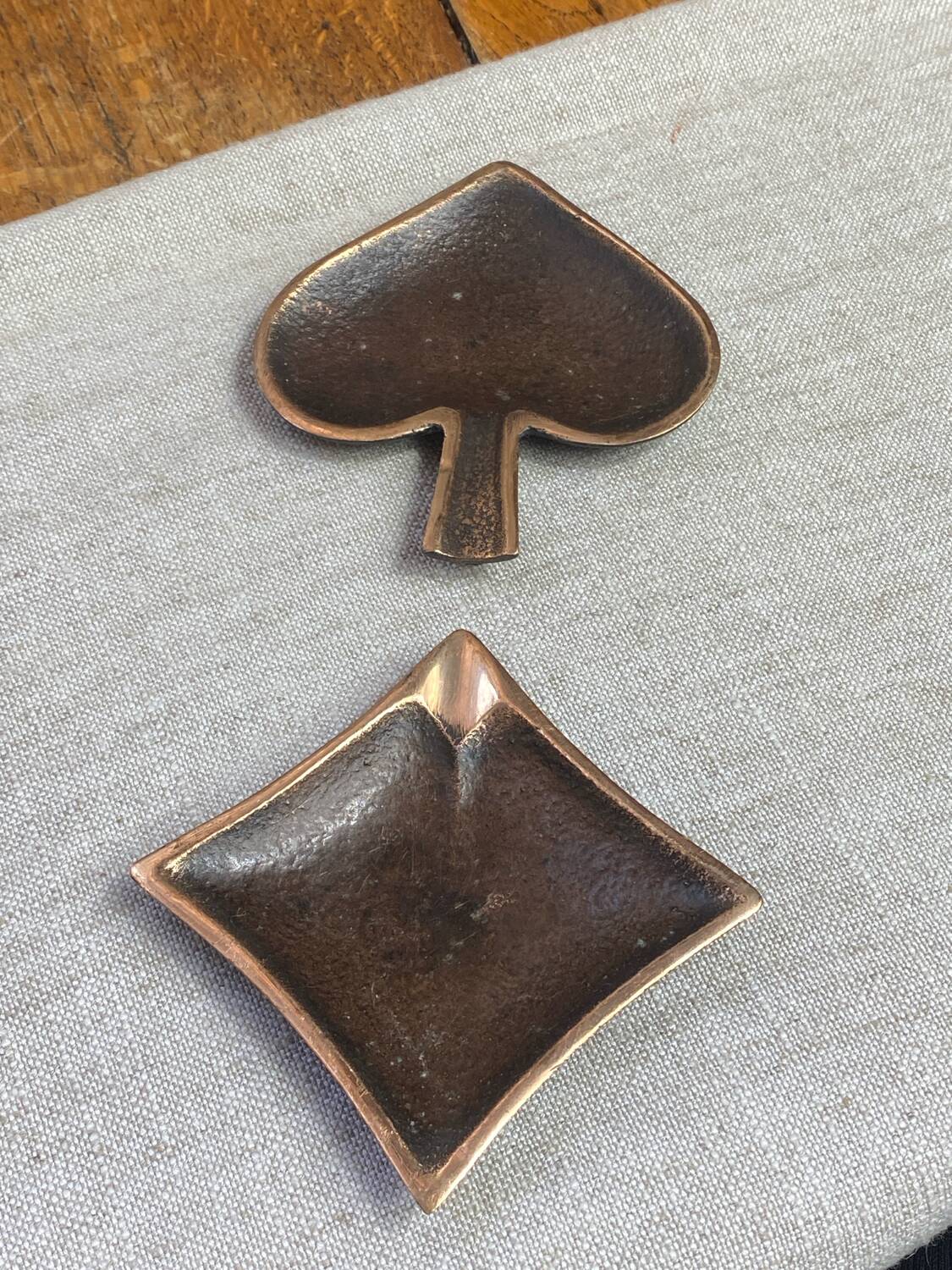 Bronze spade and diamond ashtrays