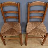 Pair of rush-seated chairs in cherry wood – late 19th century
