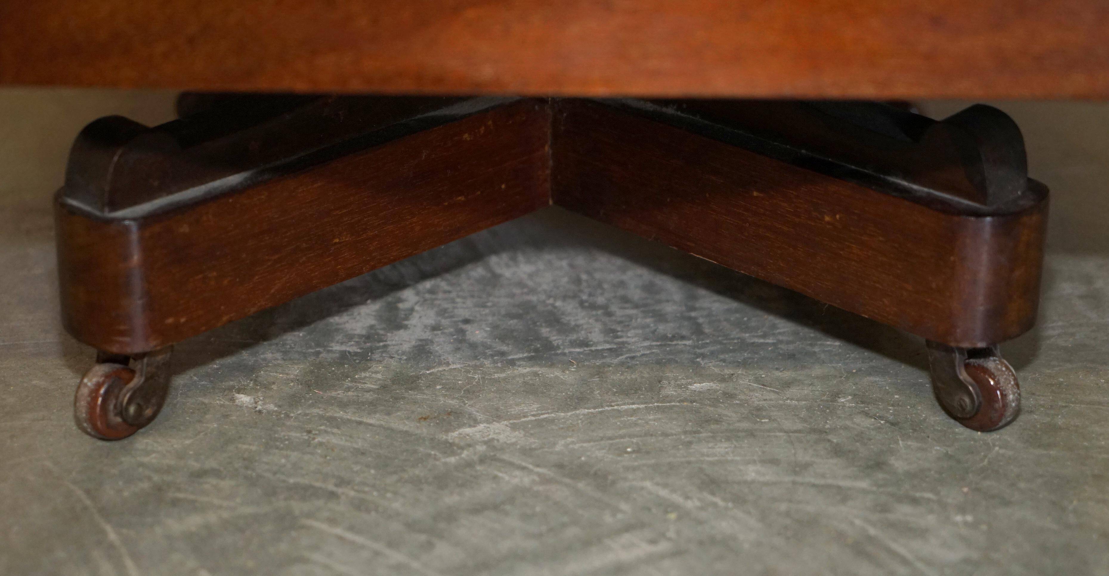 Restored Victorian walnut revolving library.