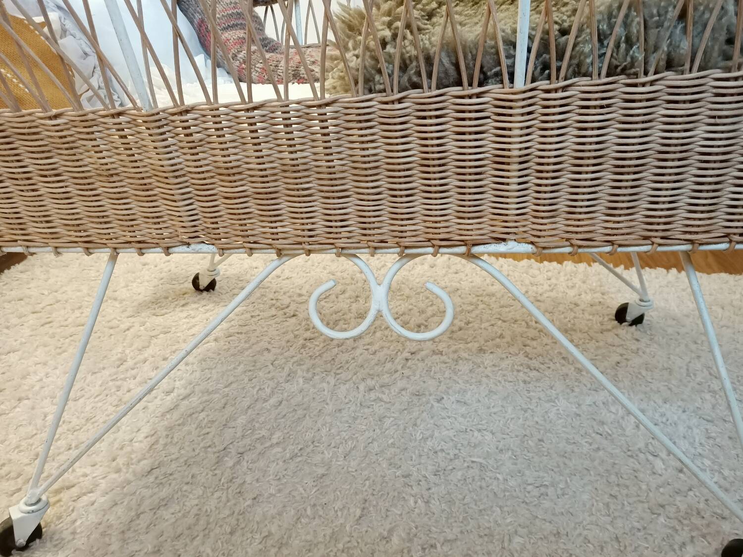 Rattan and wrought iron cradle