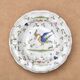 Hollow plate in Moustiers faience decorated with a bird, 19th century.