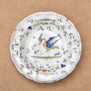 Assiette creuse en faïence de Moustiers décorée d'un oiseau, XIXe