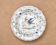 Hollow plate in Moustiers faience decorated with a bird, 19th century.