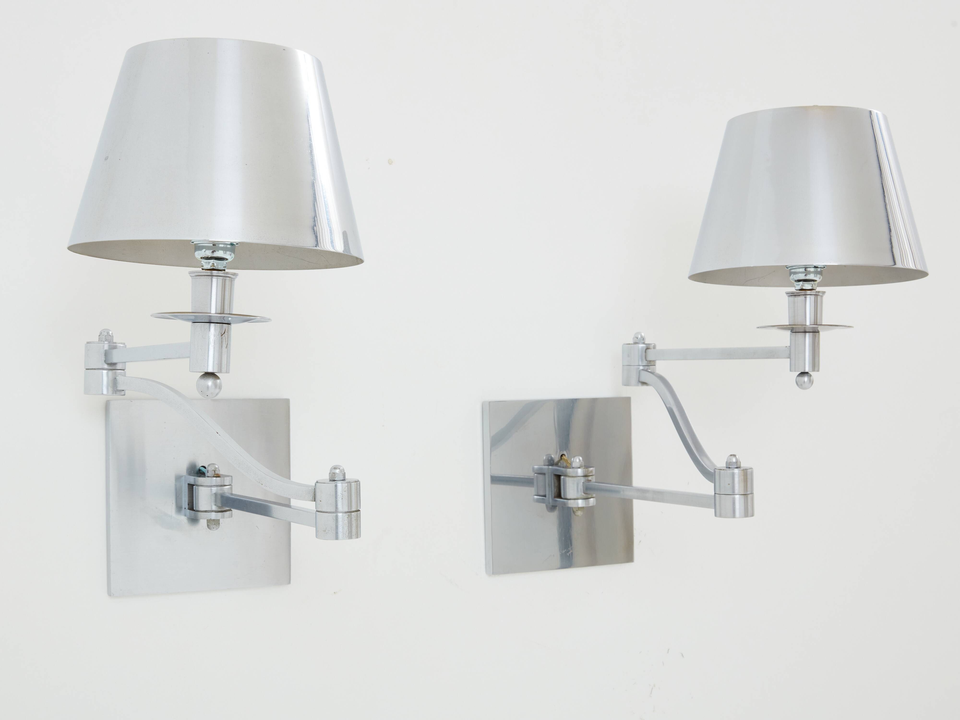 Pair of Maison Charles adjustable brushed steel wall lights circa 1960