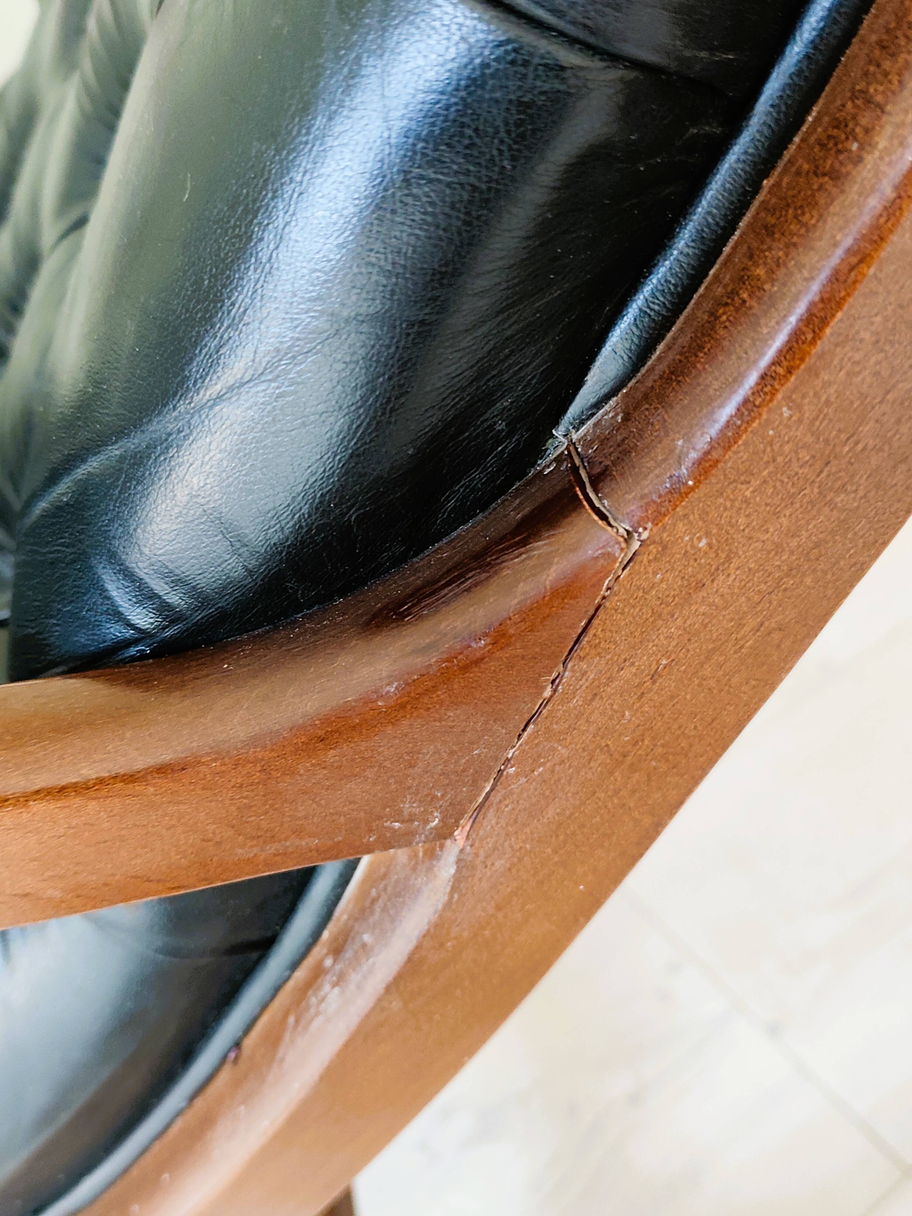 Black leather rocking Chesterfield armchair