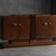 Art Deco walnut sideboard with brass details and sculptural base, France, 1930s