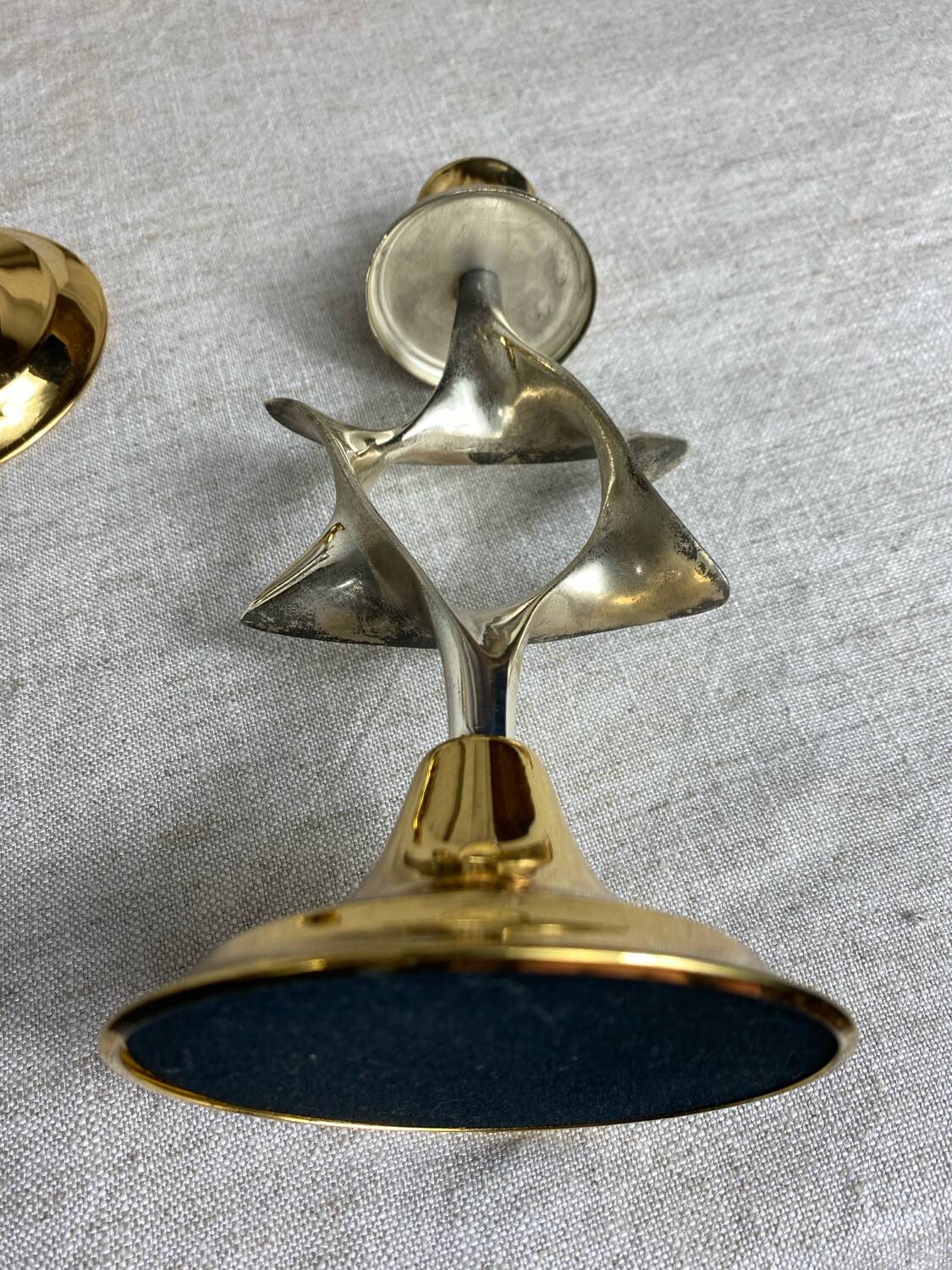 Pair of silver and gold metal candlesticks