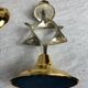 Pair of silver and gold metal candlesticks