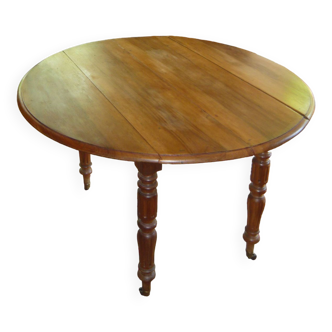 Round walnut dining table, with 2 extensions