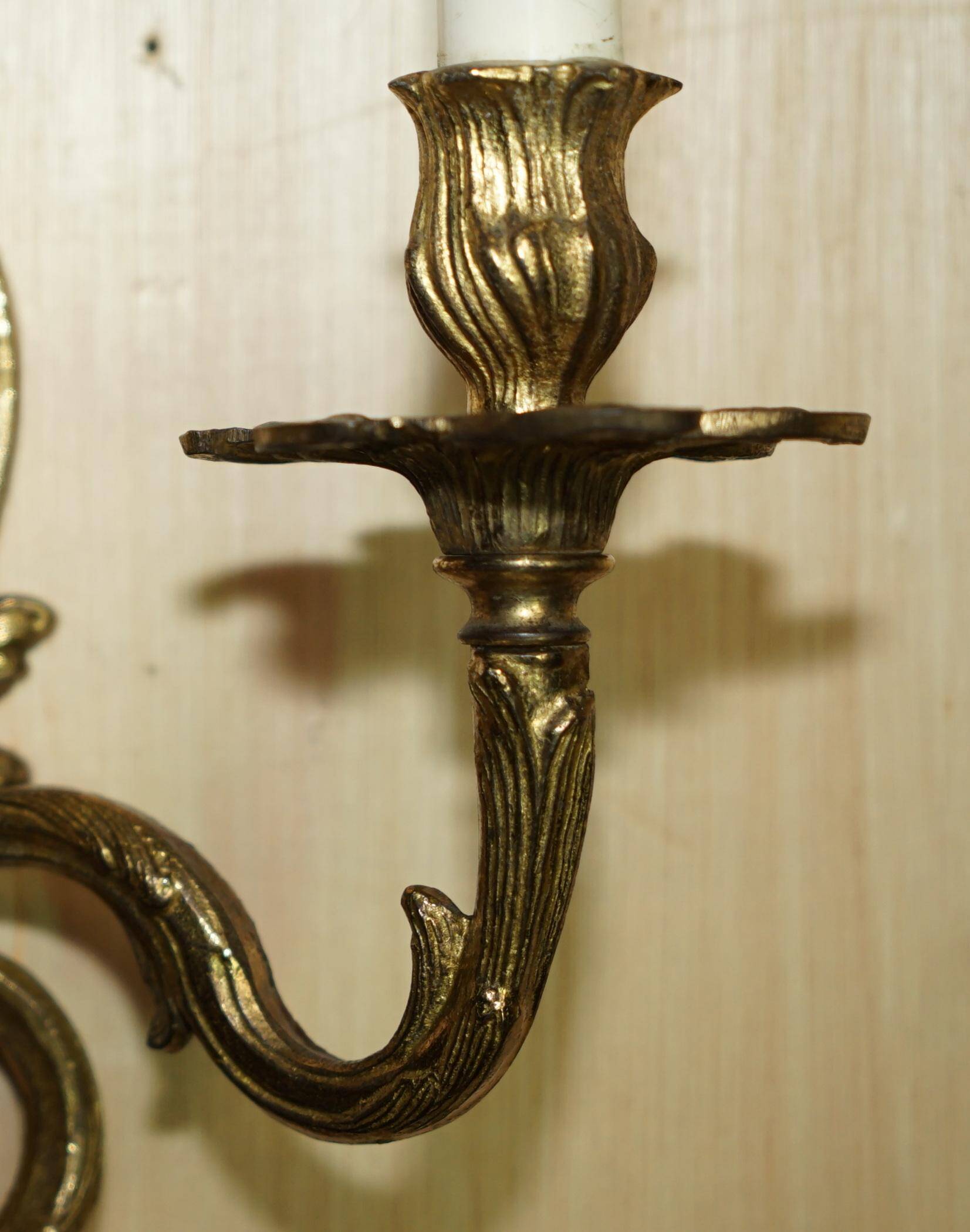 Pair of antique wall sconces from the 1920s in gilded bronze.