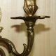 Pair of antique wall sconces from the 1920s in gilded bronze.