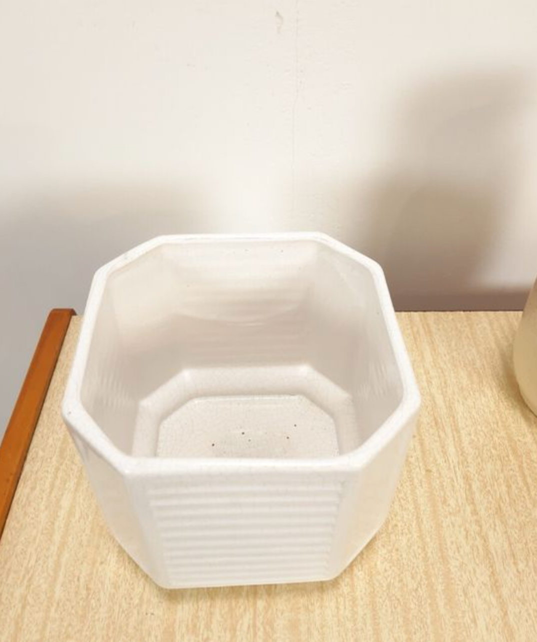 White vintage pot cover with stripes