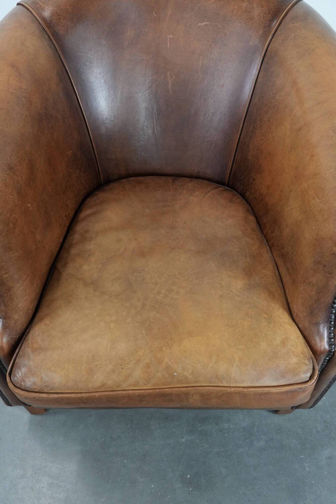 Comfortable club chair made of sheepskin leather