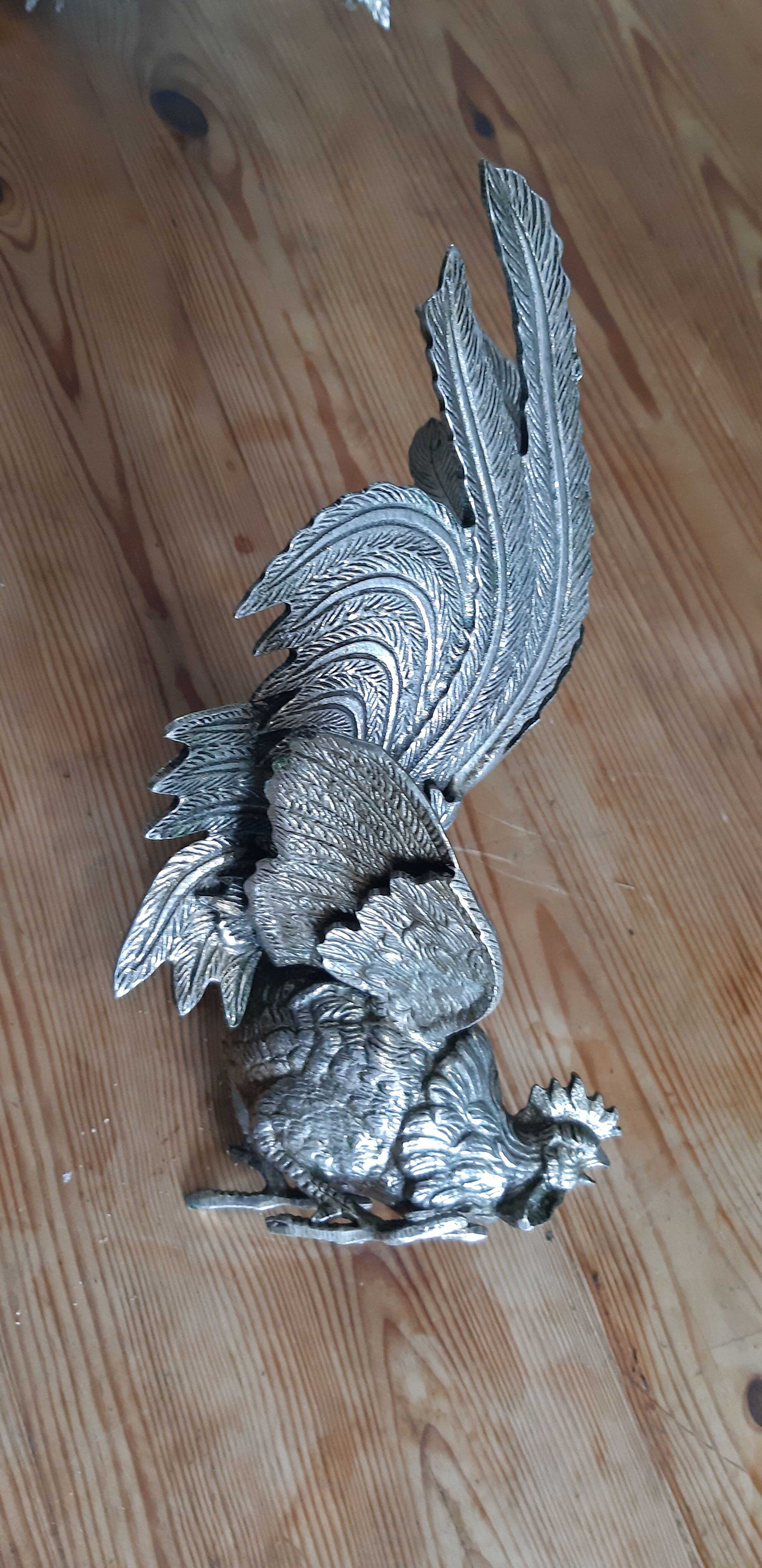 2 silver metal roosters