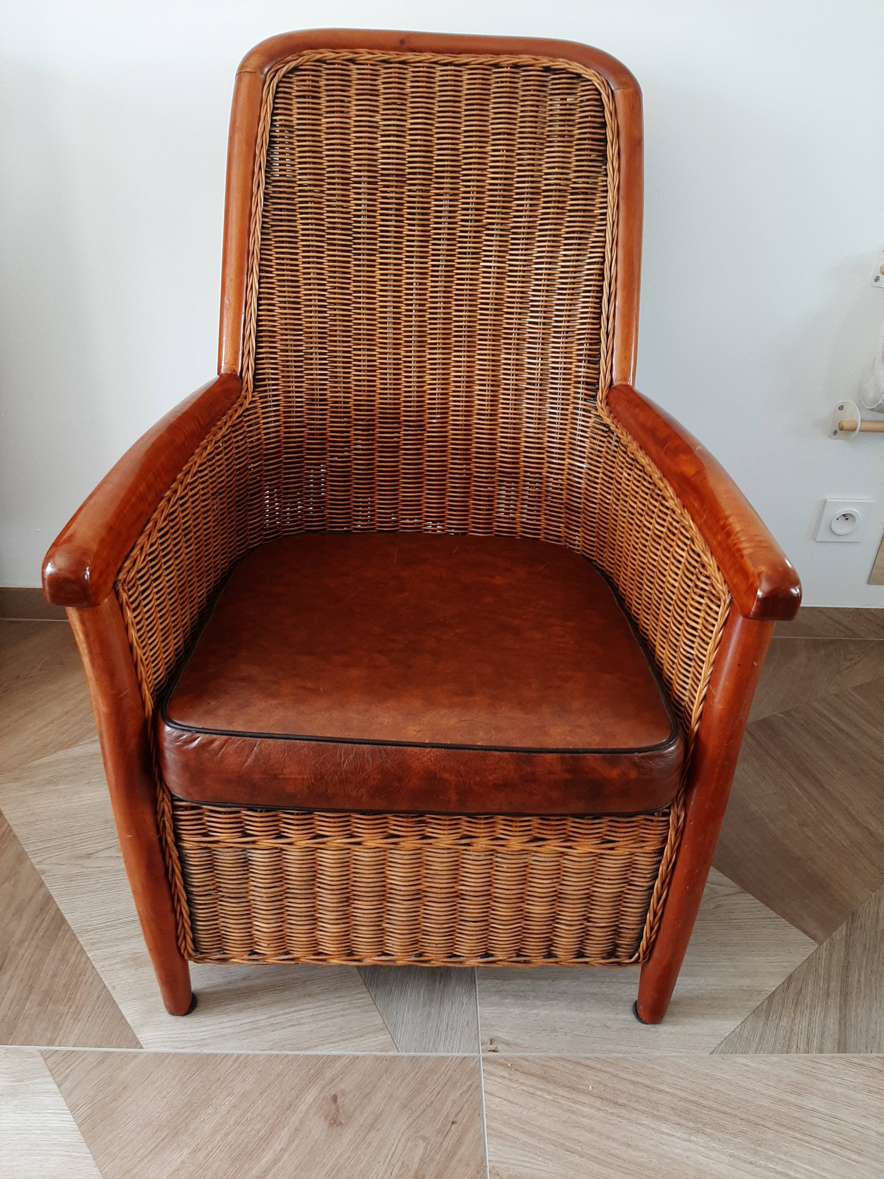 Armchair in woven rattan and exotic wood