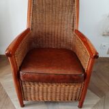 Armchair in woven rattan and exotic wood