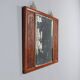 Antique mirror in exotic wood with chinoiserie carvings, 19th century.
